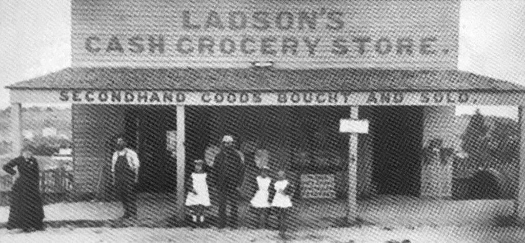 This image has an empty alt attribute; its file name is Ladsons-Cash-Grocery-Store-High-Street-1-1024x475.jpg